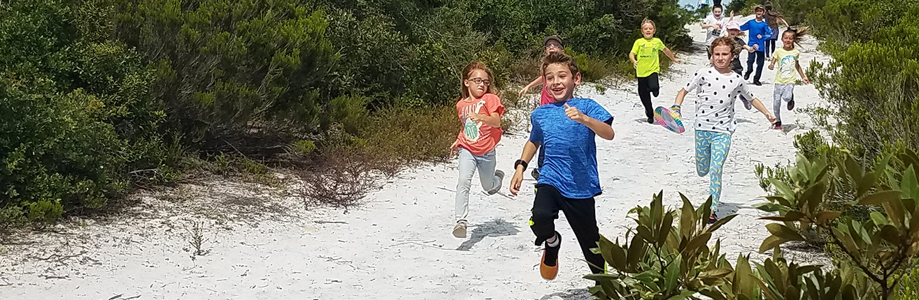 kids running on the preserve trail