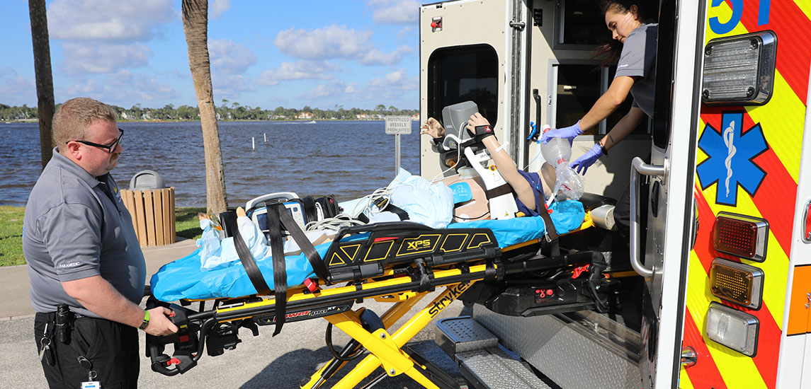 Second slide ems with patient on stretcher