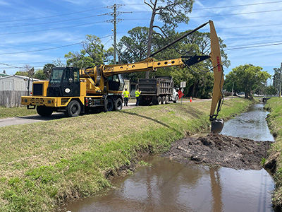 Stormwater crews performed mechanical ditch cleaning along a Mosquito Control canal