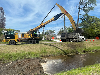 Stormwater crews performed mechanical ditch cleaning along a Mosquito Control canal