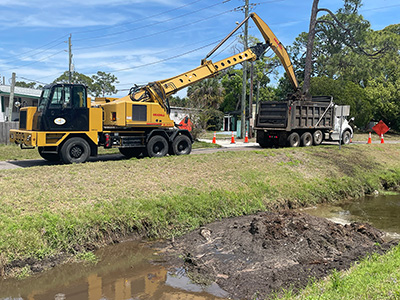 Stormwater crews performed mechanical ditch cleaning along a Mosquito Control canal