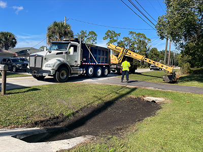 Crews cleaning ditches
