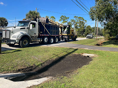 Crews cleaning ditches