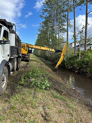 Crews removing debris from the Flomich Canal