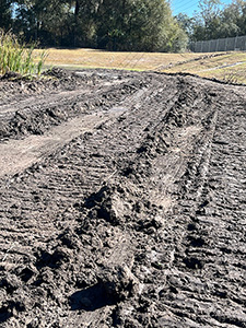 Crews de-mucking and scarifying at four retention ponds