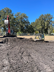 Crews de-mucking and scarifying at four retention ponds