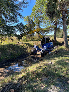 A walking “spider” excavator was deployed to the Tomoka Farms Village