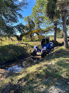 A walking “spider” excavator was deployed to the Tomoka Farms Village